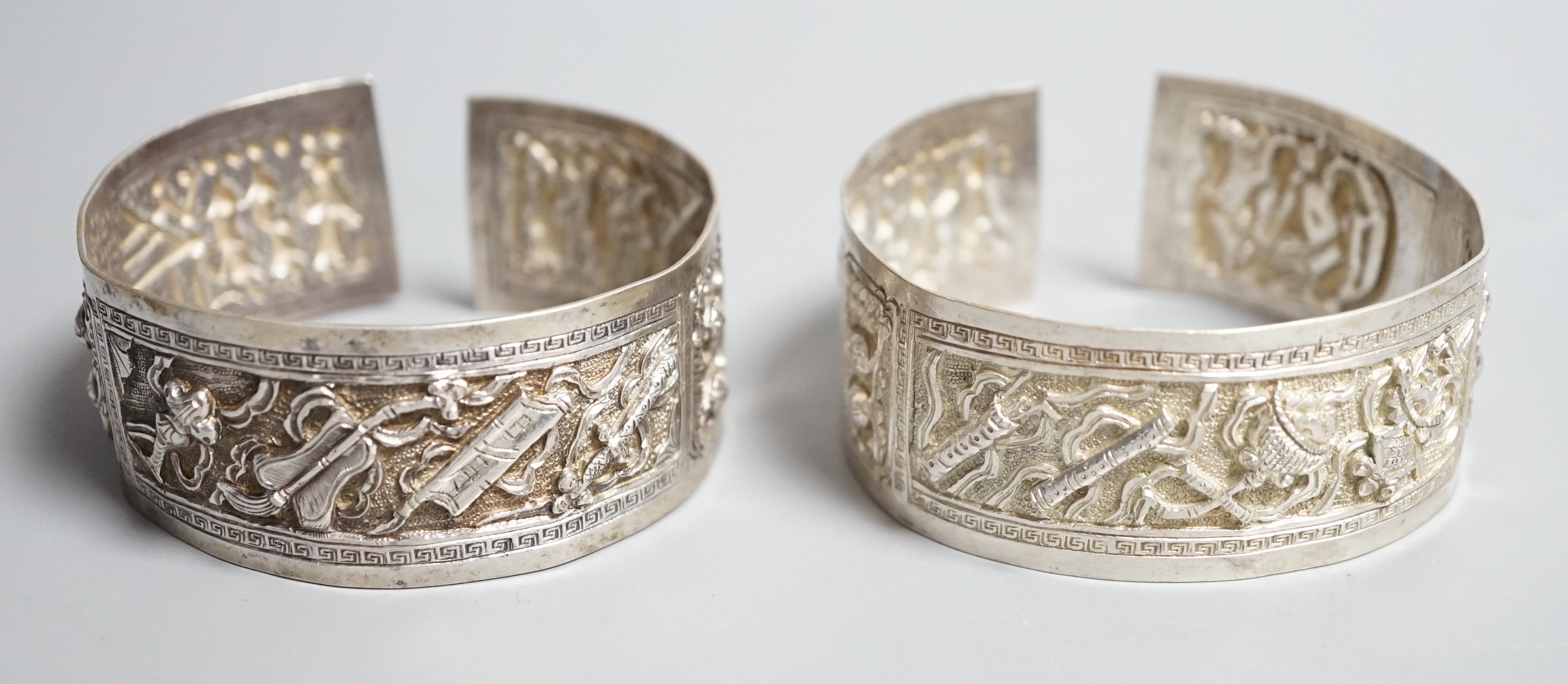 A pair of early 20th century Chinese white metal bangles